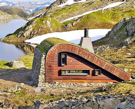 Tiny Green Roofed Cabin Hides In Remote Mountain Setting