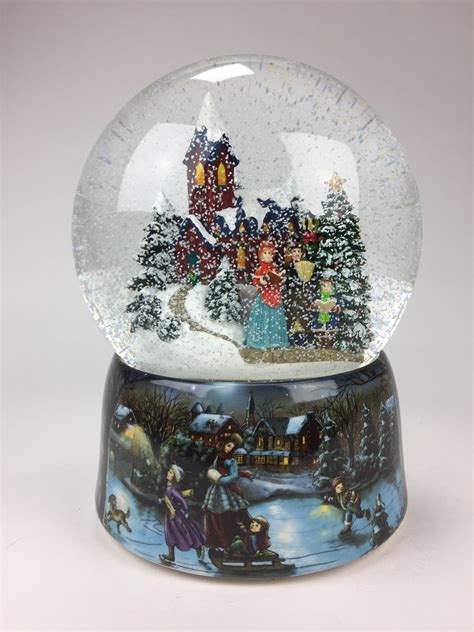 The Holiday Aisle Snow Globe With A Winter Church Scene Wayfair