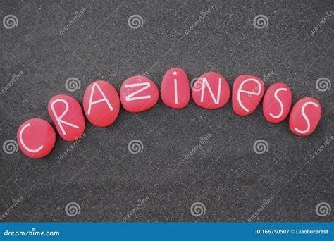 Craziness Word Composed With Red Colored And Carved Stone Letters Over