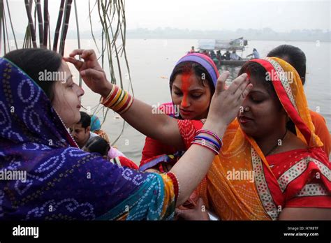 Hindu Devotees Offer Prayers To Suraya Dev On Rising Sun In The Waters