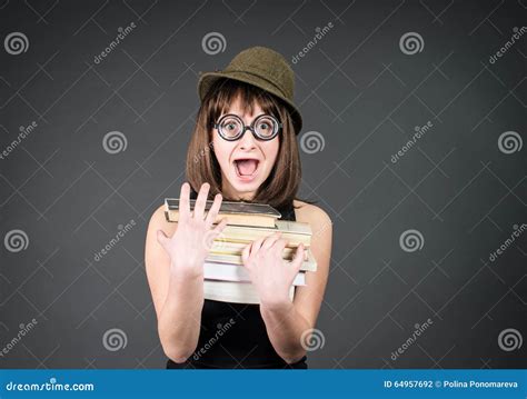 Student In Funny Glasses With Books On Grey Nerd Girl Studying