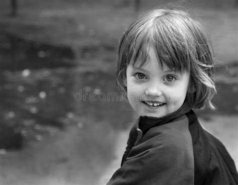 The Face Of A Happy Little Girl Black And White Image Stock Photo