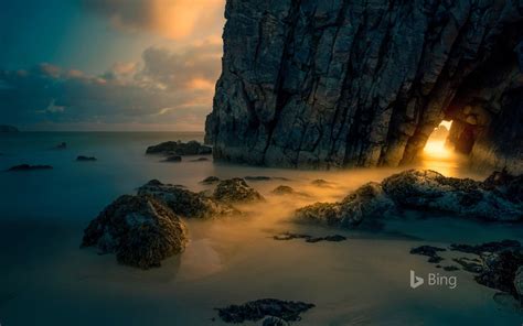 Light From Sunrise Through A Sea Cave On The Isle Of Skye