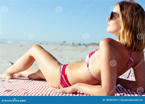 Beautiful Woman Sunbathing On The Beach Stock Photo Image Of Female Seaside
