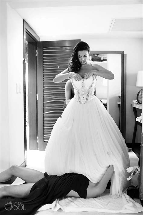 Bride Getting Ready With The Help Of A Sexy Bridesmaid At A Destination