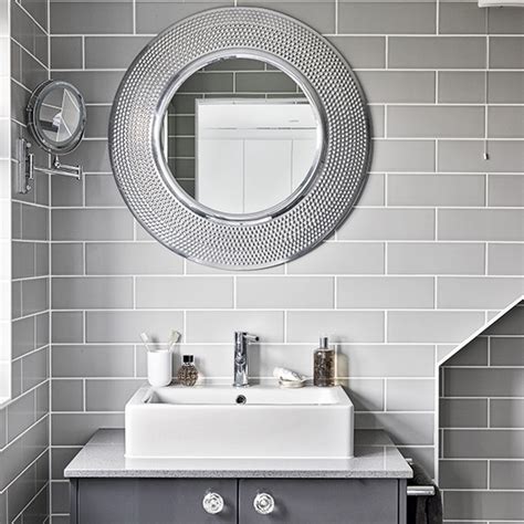 Bathroom mirrors, large or small, can add style, practicality & storage to your room. Modern grey bathroom with round mirrors | Ideal Home
