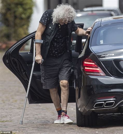 brian may walks with the aid of a crutch as he emerges after heart attack daily mail online
