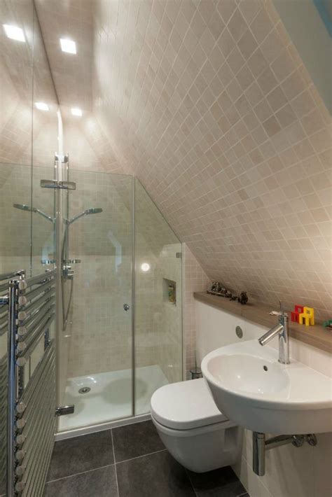 Vaulted ceilings are a desirable architectural feature and can allow for some interesting lighting choices in your home. 22 Attic bathroom ideas sloped ceiling graceful Attic ...