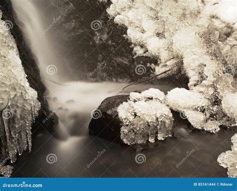 Frozen Waterfall Winter Creek Icy Stones And Branches Stock Photo