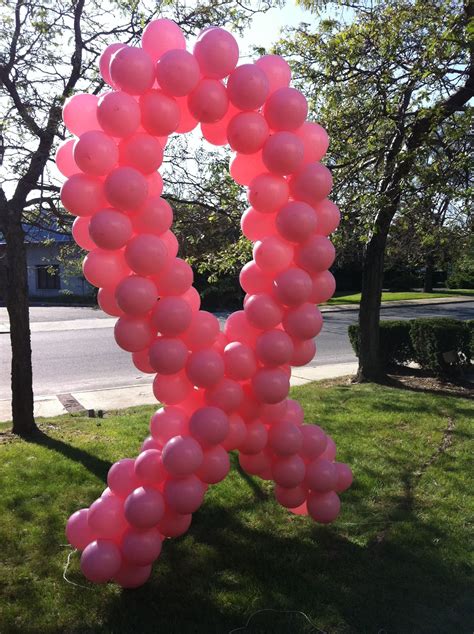 A length of hologram silver ribbon. Breast Cancer Giant Balloon Ribbon - Event Kings