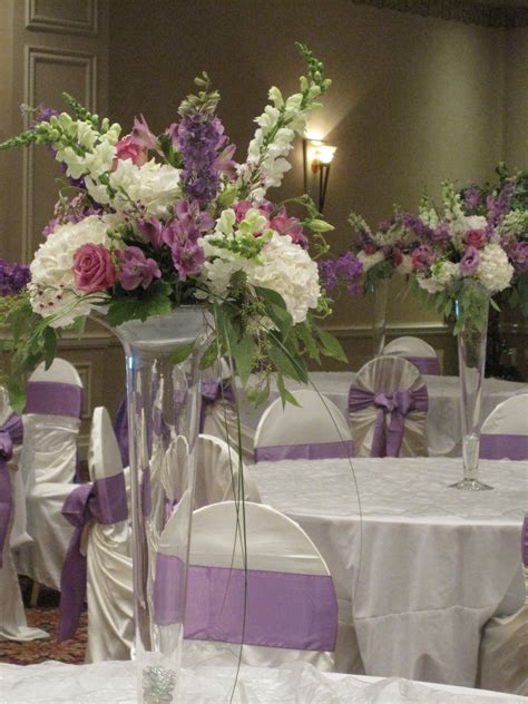 Trumpet Vase Centerpieces In Lavender And White With Hydrangea