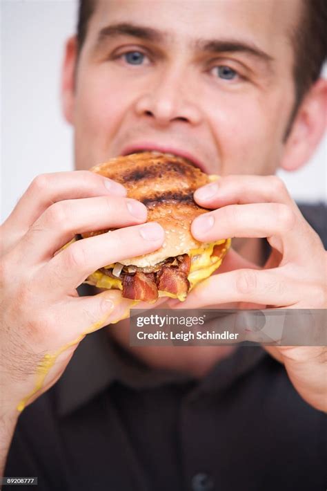 Eating Greasy Food High Res Stock Photo Getty Images