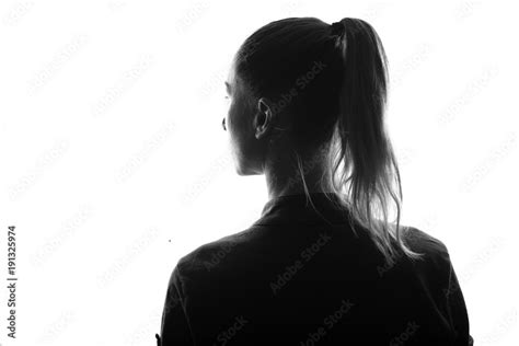 Female Person Silhouetteview From Behindback Lit Over White Stock