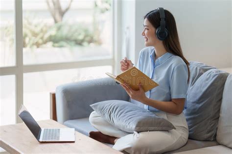 Attractive Asian Woman Resting Comfortable Living Room And Reading Book Relax Sofa Lifestyle