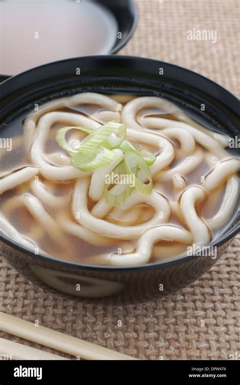 Udon Noodles In A Soup Base With Scallions Known As Kake Udon Or Su Udon In Japanese Cuisine