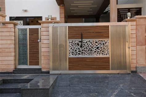 Iron gates can be used as contemporary gates besides main door to add extra security to home Modern residence modern houses by ravi - nupur architects ...