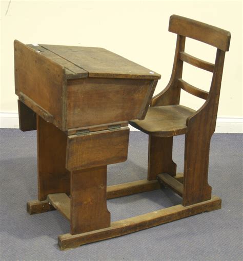 A Late Victorian Walnut And Elm School Desk With Hinged Writing Slope