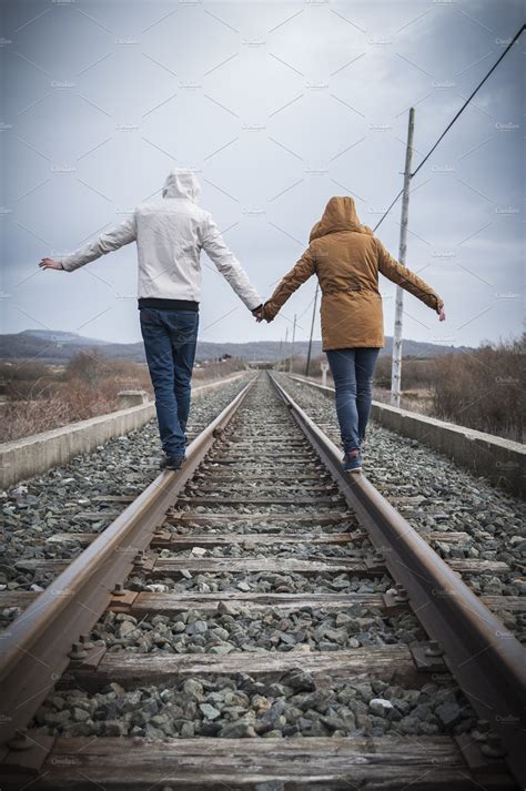 Young Couple Walking On A Railway High Quality People Images