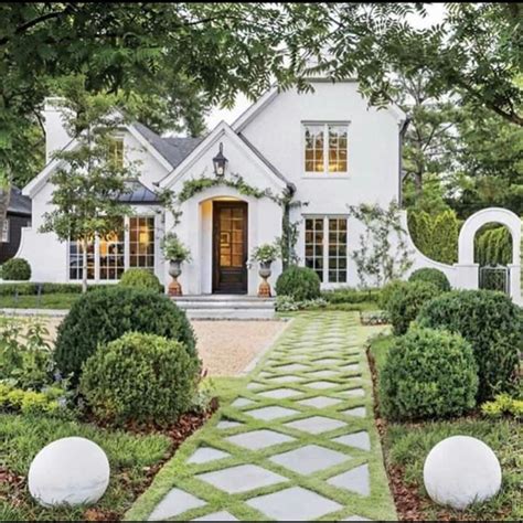 Exquisite Lattice Patterned Landscaped Walkway To Charming White Tudor