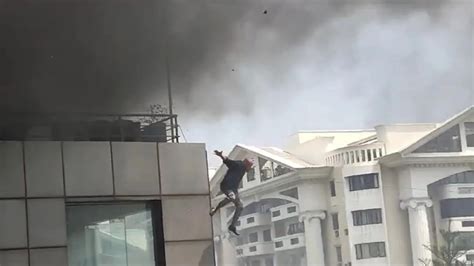 Video Explosion Fire In Bengaluru Building Man Jumps Off Roof