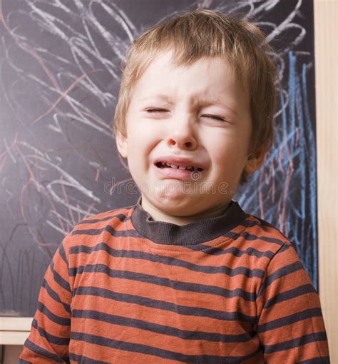 Little Cute Real Boy Screaming Crying School Near Blackboard Close Up