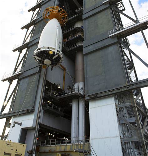 A Crane Is Used To Uplift The Payload Fairing Containing Noaas