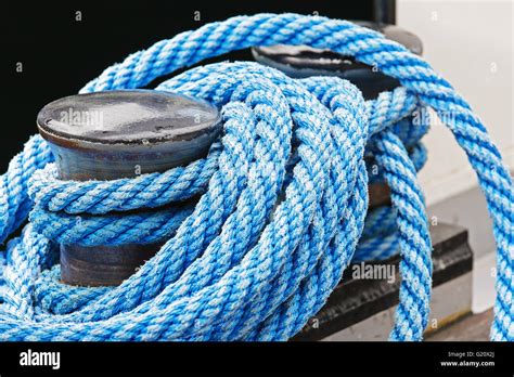 The Mooring Bollard And Blue Ropes Stock Photo Alamy