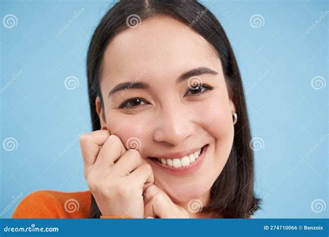 Close Up Portrait Of Beautiful Japanese Brunette Girl Smiling And Looking Lovely At Camera