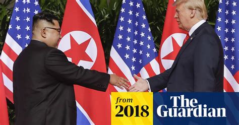 moment kim jong un and donald trump share historic handshake video world news the guardian