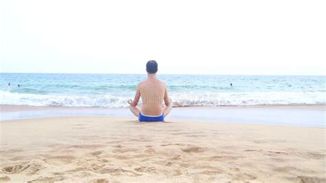 Man Meditating On Sandy Beach In The Tropics Stock Video Video Of