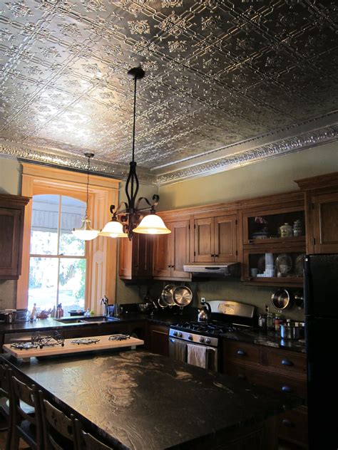 Faux tin ceiling tiles are super affordable and easy to use on a kitchen island. Tin ceiling panels in historic kitchen (With images) | Tin ...