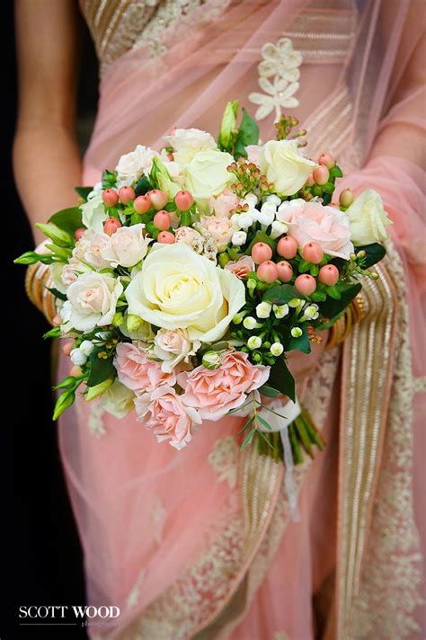 Indian Wedding Photography. Pretty in pink with a bouquet of fresh