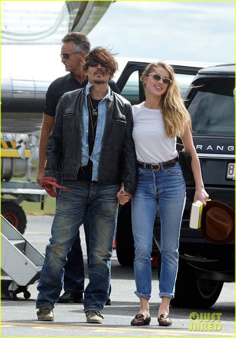 Johnny Depp And Amber Heard Hold Hands For Australian Arrival Photo