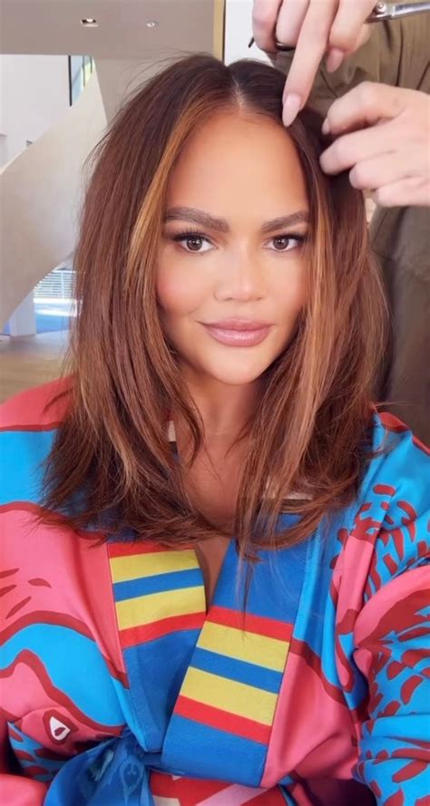 chrissy teigen shows off phase two of her dramatic red hair transformation ok magazine
