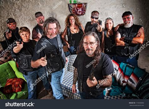 Group Of Nine Biker Gang Members In Leather Jackets Indoors Stock Photo