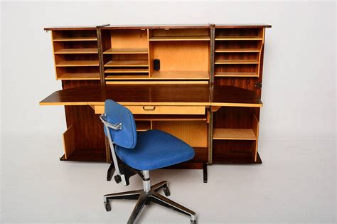Computing devices are commonly found in homes. Rosewood Hideaway Desk Cabinet For Sale at 1stdibs