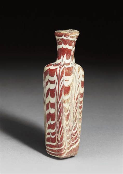 A Mamluk Marvered Opaque Red And White Glass Bottle Egypt 9th 12th