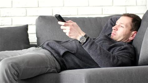 Man Lying At Sofa At Watching Tv Stock Footage Video 6555701 Shutterstock
