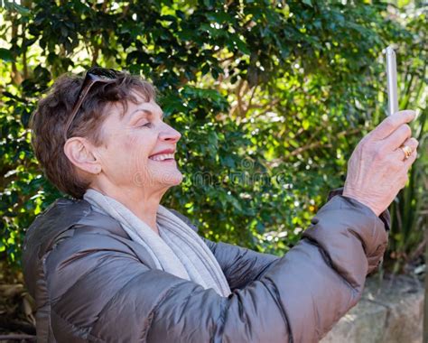 older woman taking selfie outdoors stock image image of nature selfie 73014349