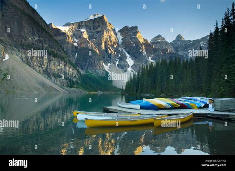 Colorful Canoes On Dock Of Moraine Lake Banff National Park Alberta