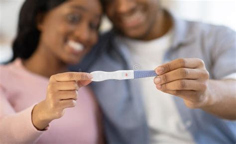 African American Married Couple Showing Positive Pregnancy Test
