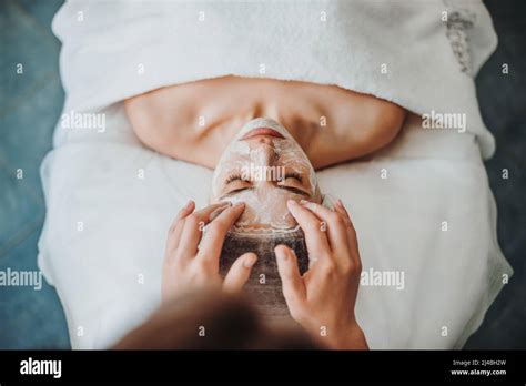 Woman Getting Facial Care By Beauticians Hands At Spa Salon Beautiful Girl Beauty Face