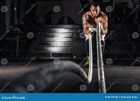 Muscular Man Working Out Doing Exercises With Dumbbells At Biceps Strong Male Naked Torso