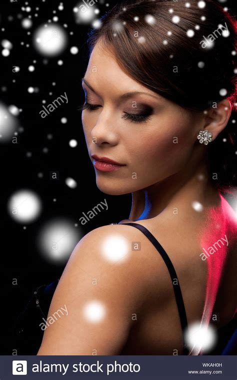 Woman In Evening Dress Wearing Diamond Earrings Stock Photo Alamy