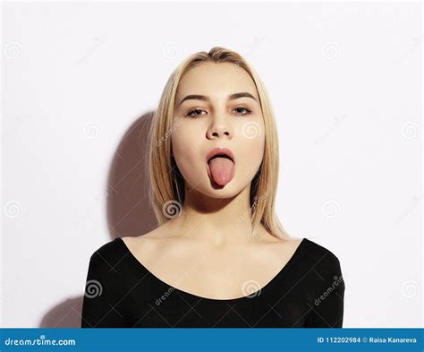 Lifestyle And People Concept Emotional Girl Beautiful Modern Model Shows Tongue Emotions On