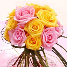 Remember the song tie a yellow ribbon round the old oak tree? Wedding Flower Centerpiece Yellow Pink Roses Arrangements ...