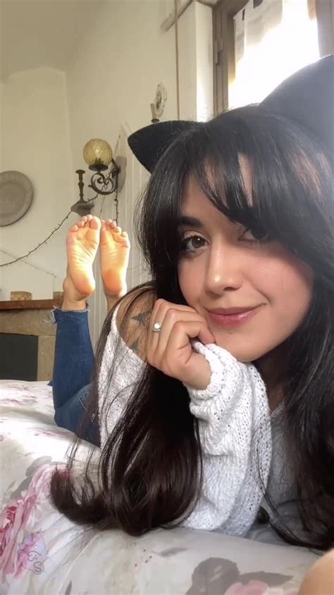 beautiful latina in jeans flirts with a camera and shows off her hot feet feet9
