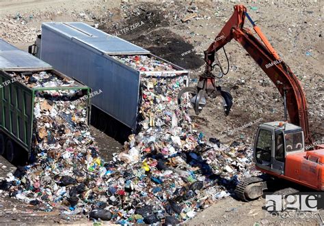 Trucks Dumping Refuse Into Landfill Stock Photo Picture And Royalty