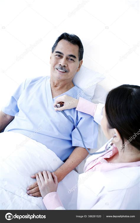 Doctor Examining Patient Ward — Stock Photo © Imagehit 386261520
