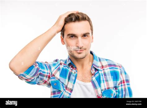 Handsome Cheerful Young Man Holding Hand On His Hair Stock Photo Alamy